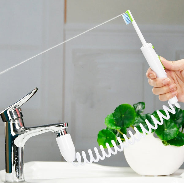 Orthodontic water spray toothbrush